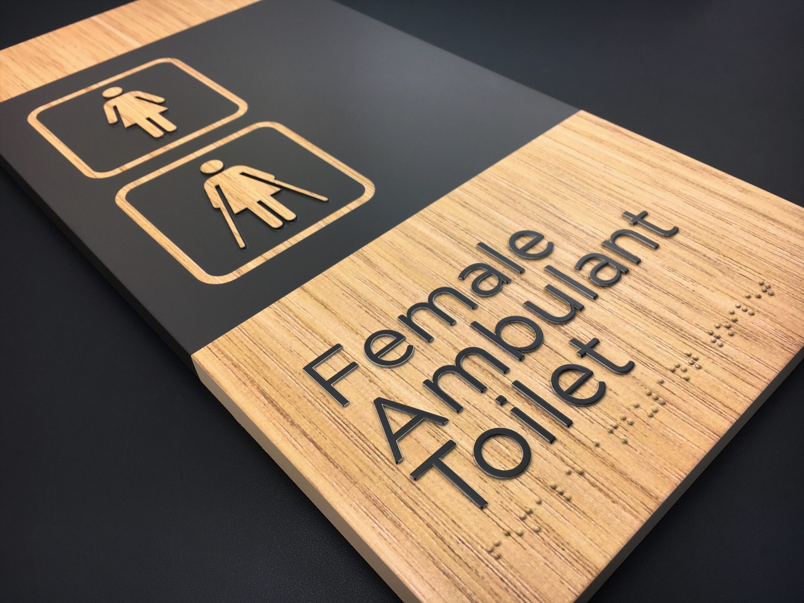Woodgrain Female Ambulant Braille Sign