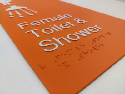 Aluminium Braille Sign produced using the BrailleFace method finished in PMS 21 2pac