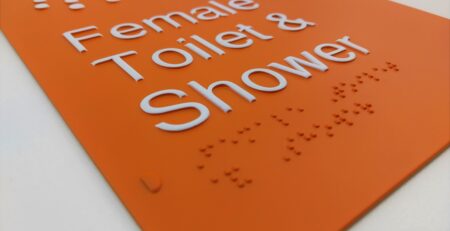 Aluminium Braille Sign produced using the BrailleFace method finished in PMS 21 2pac