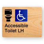 Accessible Toilet LH V2 Braille Sign in Woodgrain Acrylic. A Woodgrain colour panel with black raised tactile text & graphics including both the Toilet & Accessible symbols.