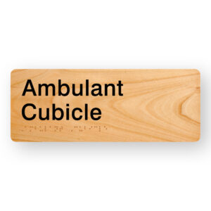 Ambulant Cubicle Braille Sign in Woodgrain Acrylic. Woodgrain background with black text that reads Ambulant Cubicle