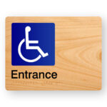 Accessible Entrance Braille Sign in Woodgrain Acrylic. Woodgrain sign panel with international symbol for access, black text that reads Entrance