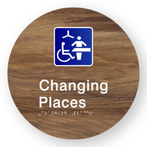 Changing Places Braille Sign on a Tactile Printed Mid-Woodgrain Acrylic Disk