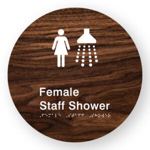 Female Staff Shower Braille Sign on a Tactile Printed Dark Woodgrain Acrylic Disk - Image 1