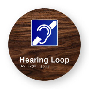 Hearing Loop Braille Sign on a Tactile Printed Dark Woodgrain Acrylic Disk - Image 1