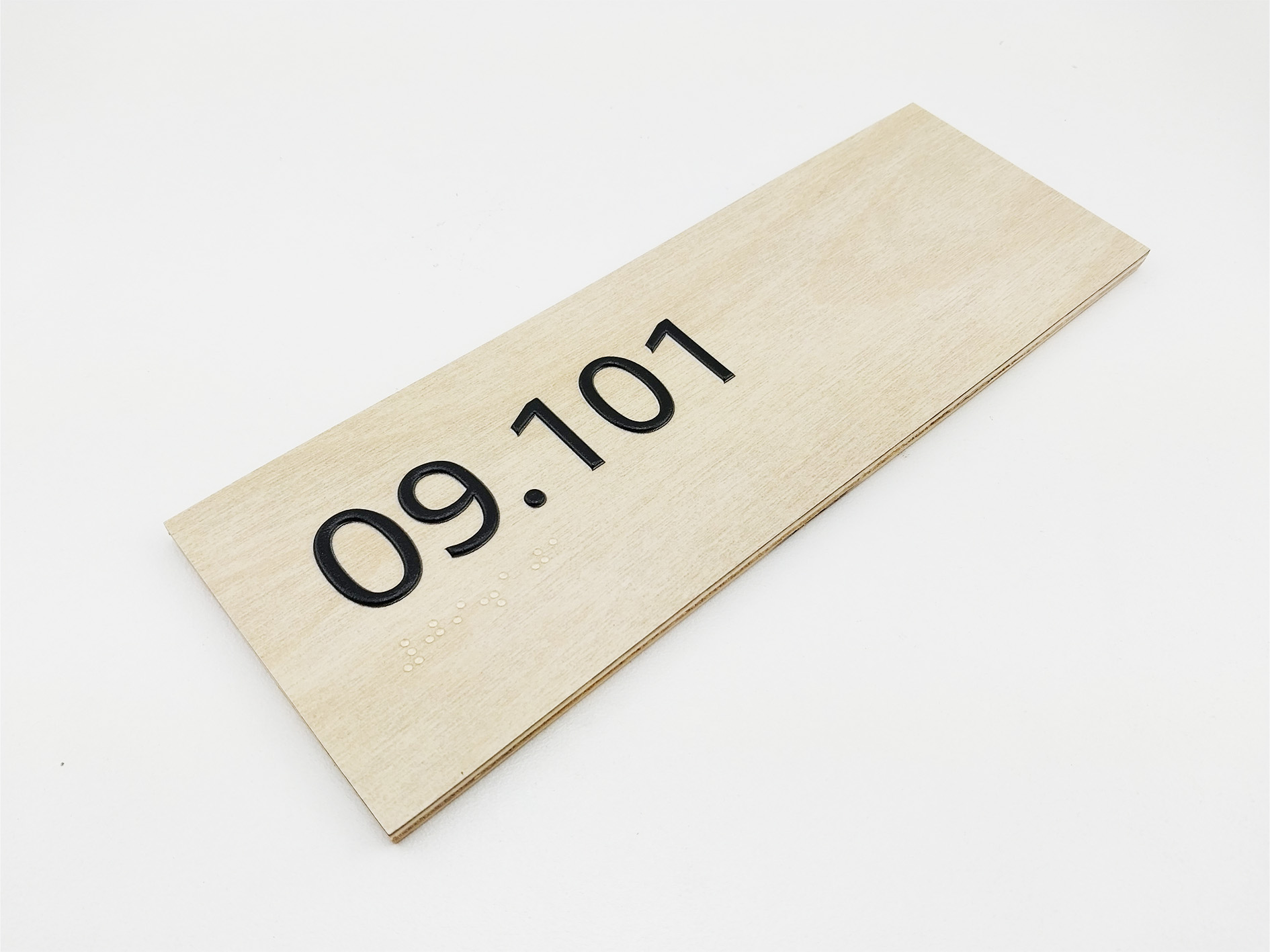 3d printed Braille Sign on Timber Laminate