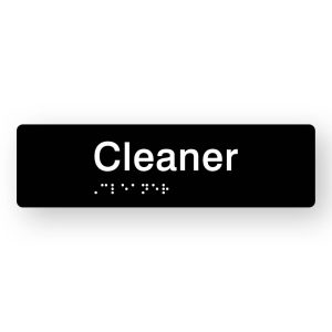 Cleaner Braille Sign in Tactile printed Black Acrylic. Black Sign panel with White Text that reads Cleaner. White Braille is shown