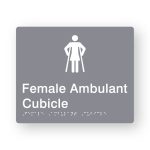 Female Ambulant Cubicle Braille Sign in Grey Tactile printed Acrylic. Grey Sign panel with white Female Ambulant Symbol. White Text reads Female Ambulant Cubicle. White Braille Text is shown
