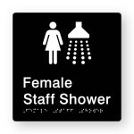 Female Staff Shower Braille Sign in Tactile Printed Black Acrylic. Black Sign Panel with White Female & Shower Symbol. White Text reads Female Staff Shower. White Braille Text is Shown