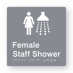 Female Staff Shower Braille Sign in Grey Tactile printed Acrylic. Grey Sign panel with white Female & Shower Symbols. White Text reads Female Staff Shower. White Braille Text is shown