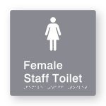 Female Staff Toilet Braille Sign in Grey Tactile printed Acrylic. Grey Sign panel with white Female Symbols. White Text reads Female Staff Toilet. White Braille Text is shown