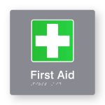 First Aid Braille Sign in Tactile Printed Grey Acrylic. Grey Sign panel with Green & White First Aid Symbol. White Text reads First Aid. White Braille is shown