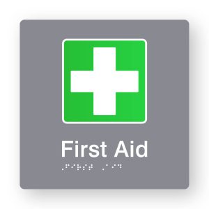 First Aid Braille Sign in Tactile Printed Grey Acrylic. Grey Sign panel with Green & White First Aid Symbol. White Text reads First Aid. White Braille is shown