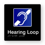 Hearing Loop Braille Sign in Tactile printed Black Acrylic. Black Sign panel with White & blue Hearing Symbol. White text reads Hearing Lop. White braille is shown