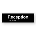 Reception Braille Sign in Tactile Printed Black Acrylic. Black Sign Panel with White Text that reads Reception. White Braille Text is shown