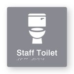 Staff Toilet Braille Sign in Grey Tactile printed Acrylic. Grey Sign panel with white Toilet Symbol. White Text reads Staff Toilet. White Braille Text is shown
