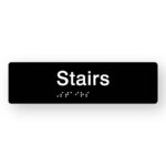 Stairs Braille Sign in Tactile Printed Black Acrylic. Black Sign Panel with White Text that reads Stairs. White Braille Text is shown