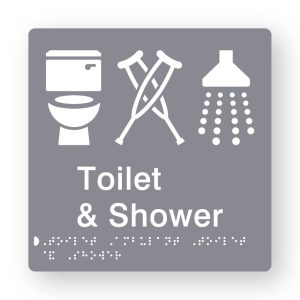 Toilet & Shower Braille Sign in Grey Tactile printed Acrylic. Grey Sign panel with white Toilet, Ambulant & Shower Symbol. White Text reads Toilet & Shower. White Braille Text is shown