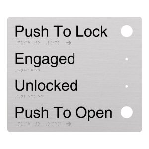 Automatic Door Braille Sign on Anodised Aluminium. Silver Sign panel with button cut outs, Black Text reads Push to Lock, Engaged, Unlock, push to Open. Braille text is shown
