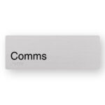 Comms Braille sign in Anodised Aluminium. Silver Sign panel with Black text that reads Comms