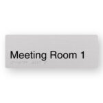 Meeting Room 1 Braille Sign in Anodised Aluminium. Silver Sign panel with Black text that reads Meeting Room 1