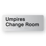 Umpires Change Room Silver Acrylic Braille Sign. Silver Sign panel with black text that reads Umpires Change room