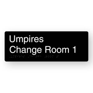 Umpires Change Room 1 Braille Sign in Black Aluminium. Black Sign panel with White Text That reads Umpires Change Room 1