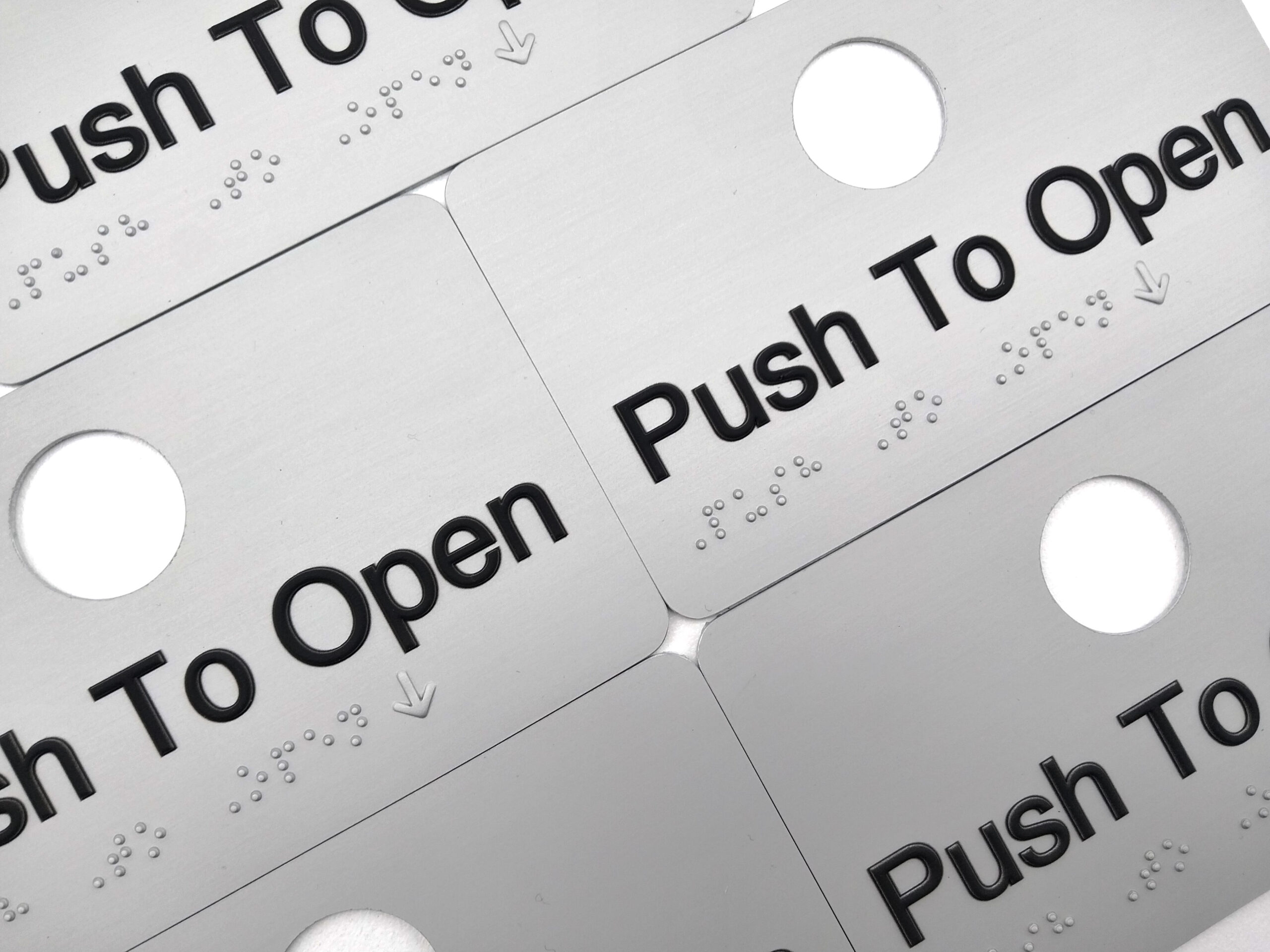 Multiple push to Open Braille Signs