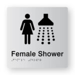 Female Shower Braille Sign tactile printed in Silver Acrylic. Silver Sign panel with Black Female & Shower Symbol. Black Text reads Female Shower. Black Braille is shown