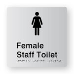 Female Staff Toilet Braille Sign in Tactile printed Silver Acrylic. Silver Sign panel with Black Female Symbol. Black text reads Female Staff Toilet. Black Braille text is shown