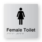Female Toilet Braille Sign in Tactile printed Silver Acrylic. Silver Sign Panel with Black Female Symbol & Text that reads Female Toilet. Black Braille text is shown