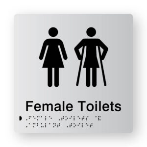 Female Toilet Braille Sign in Tactile Printed Silver Acrylic. Silver Sign panel with Black Female 7 female Ambulant Symbols. Black Text reads Female Toilets. Black Braille text is shown