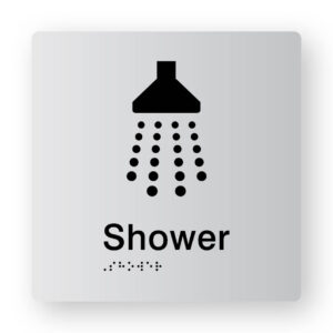 Shower Braille Sign in Tactile Printed Silver Acrylic. Silver Sign Panel with Black Shower Symbol. Black text reads Shower. Black Braille Text is shown