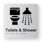 Toilet & Shower Braille Sign in Tactile Printed Silver Acrylic. Silver Sign panel with Black Toilet & Shower Symbol. Black Text reads Toilets & Shower. Black Braille text is shown