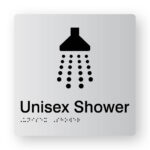 Unisex Shower Braille Sign in Tactile Printed Silver Acrylic. Silver Sign panel with Black Shower Symbol. Black text reads Unisex Shower. Black Braille is shown