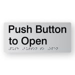 Push Button to Open Braille Sign in Tactile printed Silver Acrylic. Silver Sign Panel with Black Text that reads Push Button to Open. Black Braille text is shown