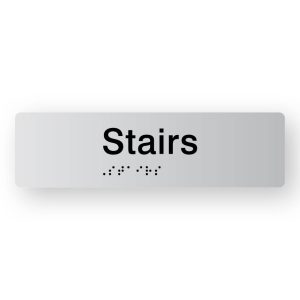 Stairs Braille Sign in Tactile printed Silver Acrylic. Silver Sign Panel with Black Text that reads Stairs. Black Braille text is shown