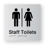 Airlock - Staff Toilets braille Sign in Tactile Printed Silver Acrylic. Silver Sign panel with Black Male, Airlock, & Female Symbols. Black text reads Staff Toilets. Black Braille Text is shown