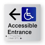 Accessible Entrance Braille Sign with Left Arrow, Tactile printed in Silver Acrylic. Silver Sign panel with Black Left Arrow & Blue & White Accessible Symbol. Black Text reads Accessible Entrance. Black Braille text is shown.
