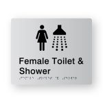 Female Toilet & Shower Braille Sign in Tactile Printed Silver Acrylic. Silver Sign panel with Black Female & Shower Symbol. Black text reads Female Toilet & Shower Change, Black Braille text is shown