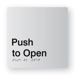 Push to Open Braille Sign in Tactile printed Silver Acrylic. Silver Sign Panel with Black Text that reads Push to Open. Black Braille text is shown