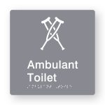 Ambulant Toilet Braille Sign in Grey Tactile printed Acrylic. Grey Sign panel with white Ambulant Symbol. White Text reads Ambulant Toilet. White Braille Text is shown