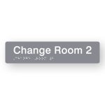 Change Room 2 Braille Sign in Tactile printed Grey Acrylic. Grey Sign panel with White Text that reads Change Room 2. White Braille is shown