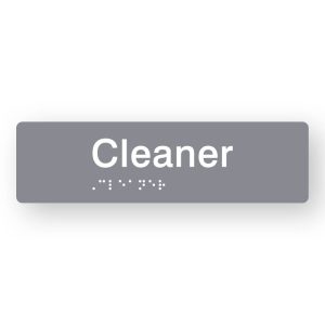 Cleaner Braille Sign in Tactile printed Grey Acrylic. Grey Sign panel with White Text that reads Cleaner. White Braille is shown