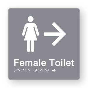 Female Toilet Braille Sign with Right Arrow in Tactile printed Grey Acrylic. Grey Sign panel with White Female Symbol & Right Arrow. White text reads Female Toilet. White Braille is shown