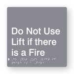 Do Not Use Lift in Case of Fire Open Braille Sign in Grey tactile Printed Acrylic. Grey Sign panel with White text & braille