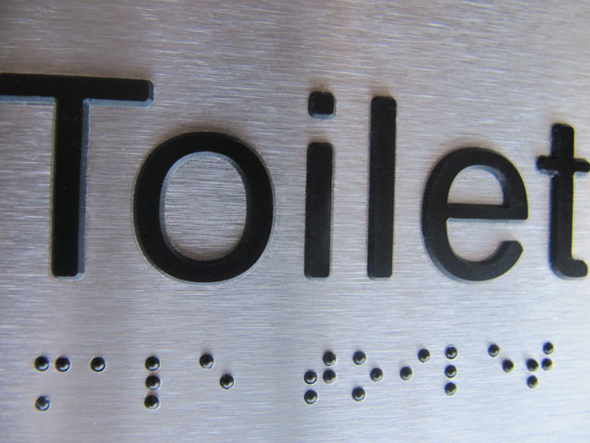 Close up image of one of our Stainless Steel Braille Signs